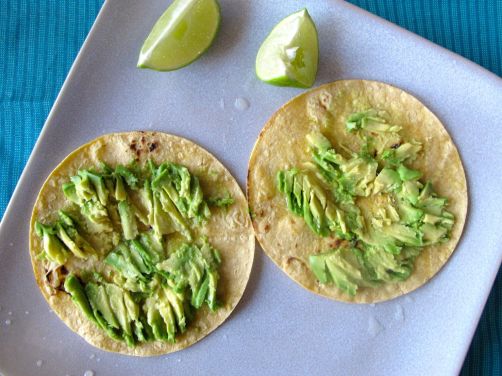 Avocado and lime on charred tortillas